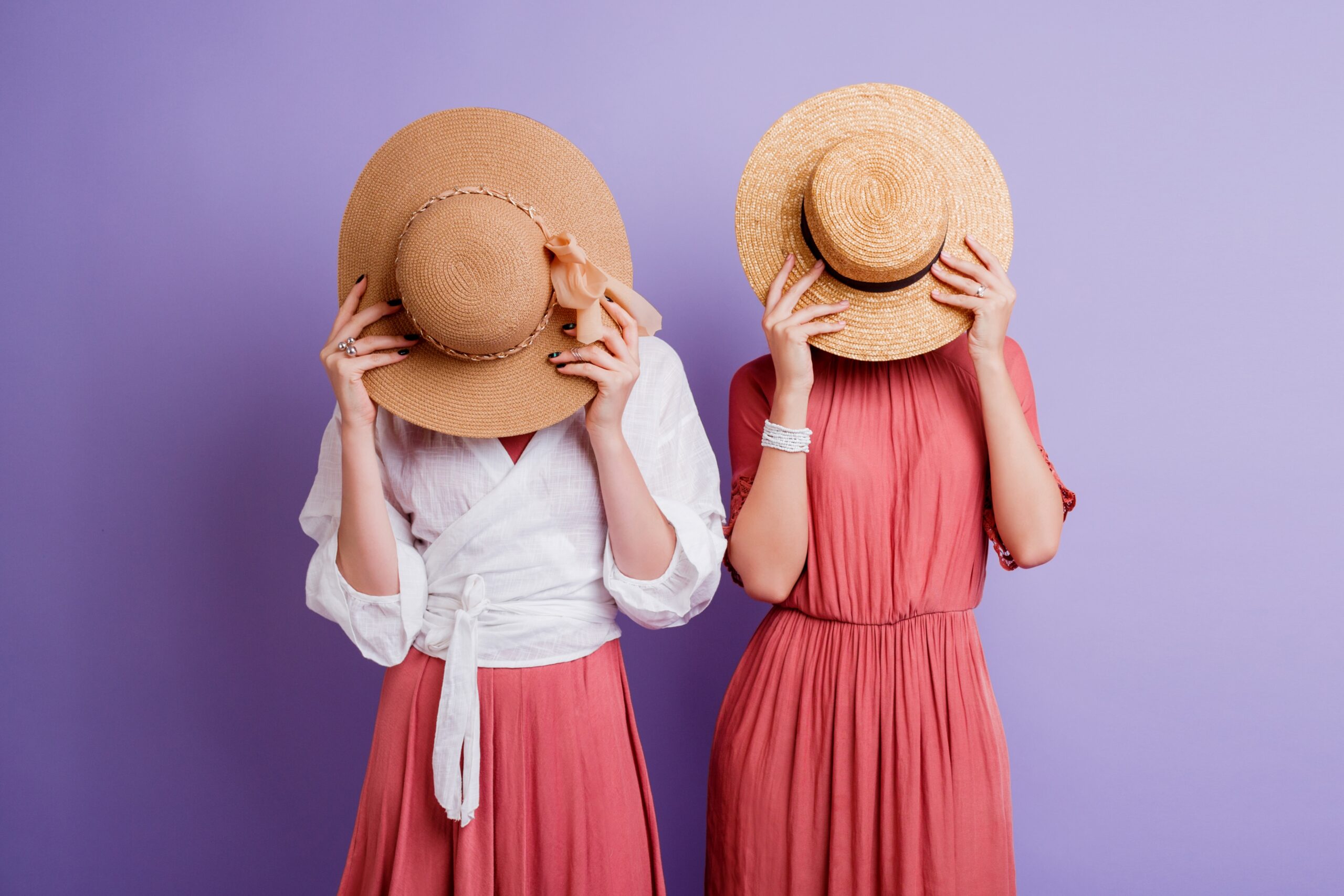 two woman posing in spring dresses